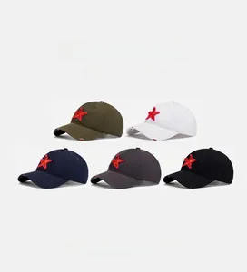 Detailed view of distressed baseball caps with red star embroidery in five vintage colors