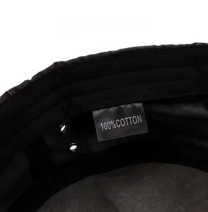 Detail view of cotton military cap interior featuring breathable eyelets and care label