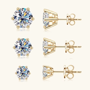 Three pairs of gold moissanite stud earrings in 6-prong setting with size comparison