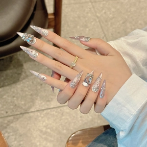 Luxurious handmade press-on nails with pink gradient, rhinestones, and butterfly charms