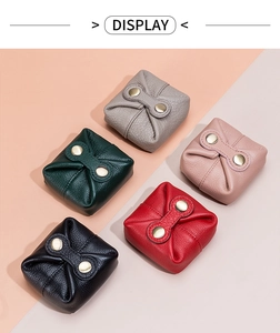 Detailed macro view of litchi texture leather coin purses in five vibrant colors