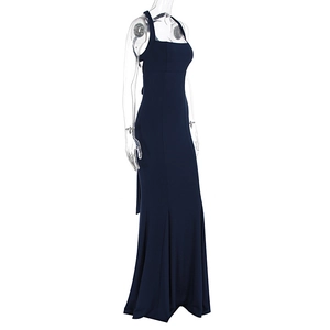Detail of elegant navy blue halter neck maxi dress with slim fit and fishtail hemline