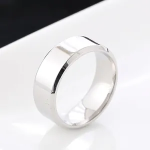 Macro detail of 4mm bevelled edge stainless steel ring with polished silver finish
