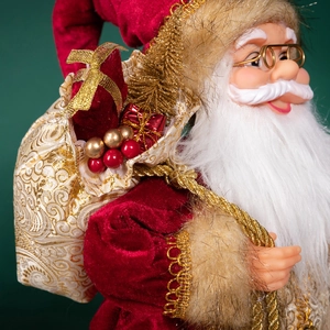 Poupée Père Noël classique en velours rouge avec détails dorés et sac de cadeaux