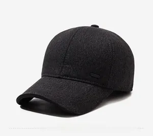 Detailed 45-degree side view of dark grey wool fabric baseball cap with sport logo