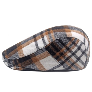 Close-up of vintage brown plaid wool fabric texture on a classic men's flat cap
