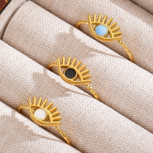 Three bohemian stainless steel sunflower evil eye rings in gold with colorful stones