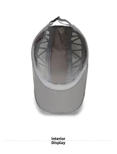 Interior detail of grey breathable mesh lining on men's quick-dry sun hat with adjustable strap