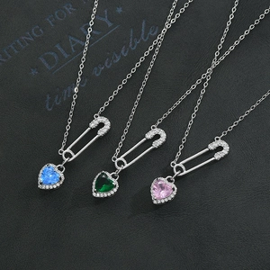 Silver safety pin necklace with heart-shaped zircon pendants in blue, pink and green