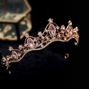 Close-up of pink crystal marquise stones on a rose gold Baroque crown headpiece