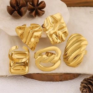 Detailed view of assorted 18k gold plated geometric and textured stackable rings