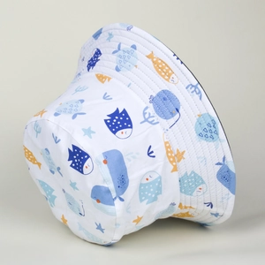 Detail shot of white bucket hat with blue and orange sea animal prints for kids
