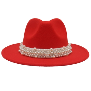 Detailed view of the red wool fedora featuring a wide pearl embellished band and brim