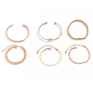Detailed set of six gold-plated minimalist bracelets with various chain styles and beads