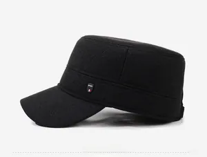 Side view of a black winter flat top military cap for men with a SPORT rubber emblem