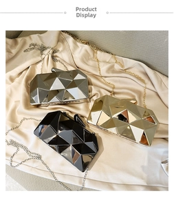 Three acrylic clutch bags in silver gold and black with geometric mirrored surfaces