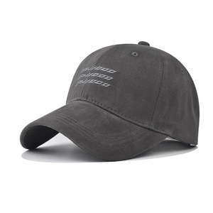 Close-up of three-row embroidered DAVOOD lettering on charcoal cotton baseball cap