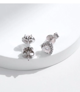 Macro view of S925 sterling silver heart earrings with sparkling moissanite stones