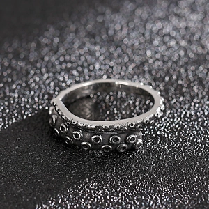 Detailed macro view of retro octopus tentacle ring featuring realistic suction cups texture