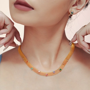 Mesh chain jewelry set with gold PVD coating and multicolor zircon stones on model