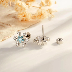 Pair of snowflake cartilage studs with blue star zircon and secure screw flat back posts