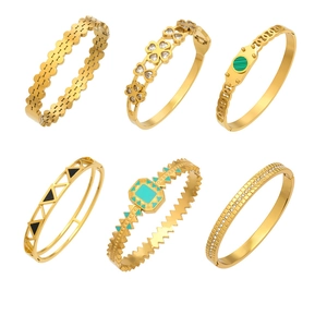 Set of six vintage gold-plated stainless steel bangles with geometric hollow floral patterns