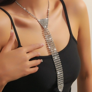 Sparkling silver tie-shaped tassel necklace with rhinestones worn by a fashion model