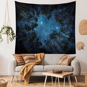 Detail showing the forest night sky tapestry hanging as a living room wall decoration