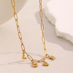 Close-up of 18K gold plated paperclip chain necklace with LOVE letter pendants