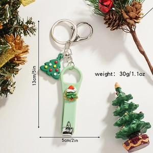 Detailed view of Christmas tree nail clipper keychain with dimension specs 13x5cm