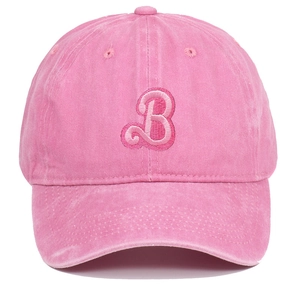 Detail of pink washed cotton baseball cap with embroidered letter B on a standard curved brim