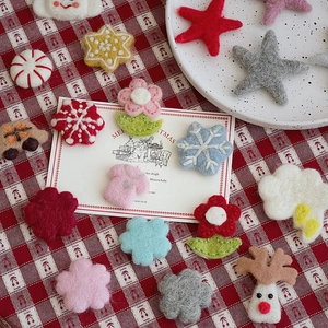 Close-up of colorful wool felt stars, snowflakes and reindeer for Christmas DIY crafts