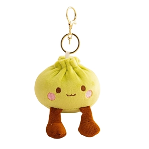 Cute green dumpling plush keychain with embroidered face and golden metal clasp hanging