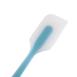 Translucent white silicone spatula with blue handle core for cake baking and mixing