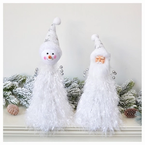 Detail of plush Santa and Snowman figurines with sequined pointed hats for Christmas decor