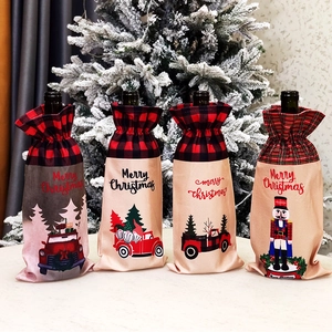 Detailed view of festive Christmas wine bottle bags with plaid tops and merry patterns