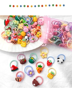 Detail shot of colorful cartoon elastic hair bands for kids with cute animal resin charms