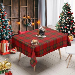 Festive red and green checkered tablecloth detail in a cozy Christmas setting
