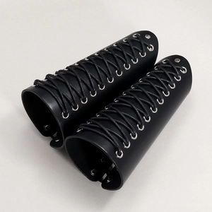 Adjustable black leather arm bracers with silver eyelets and crisscross lacing detail