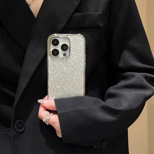Sleek silver glitter plated case for iPhone 15/14 Pro Max held by a person in a suit