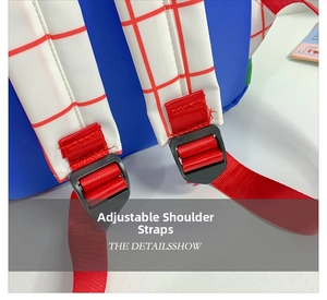 Detail of adjustable red and white checkered straps on a blue canvas kids backpack