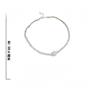 Detailed view of silver choker necklace with rhinestones, 38.6cm length and 5.6g weight