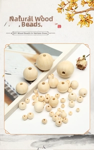 Macro shot of natural unfinished round wooden beads with smooth texture and drill holes