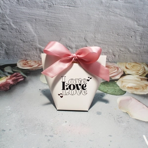 Romantic white wedding favor box with pink ribbon and Love art lettering for gifts