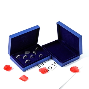 Royal blue textured jewelry gift boxes with silver vintage rings and velvet lining