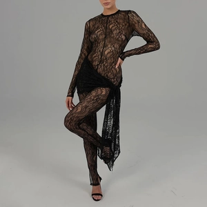 Detail of sheer black floral lace pattern on the long sleeve and bodice of the bodysuit
