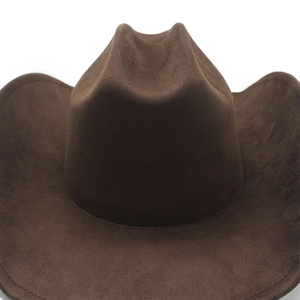 Close-up of a wide-brimmed dark brown faux suede western cowboy hat with a cattleman crown