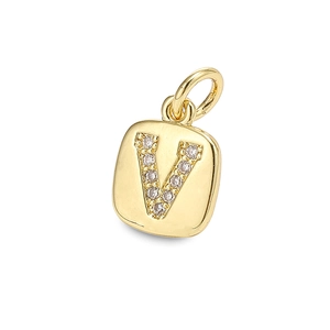 Macro detail of gold-plated square pendant featuring zircon-encrusted letter V design