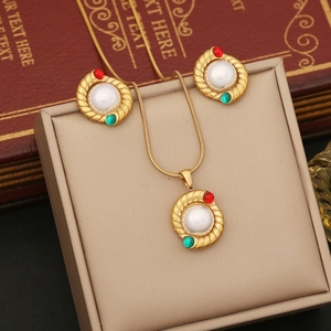 Vintage gold necklace and earring set with white pearls and red green gemstones