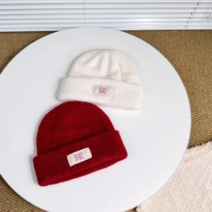 Kids warm wool double-layer knit beanies in cream and burgundy with BAKE fabric label
